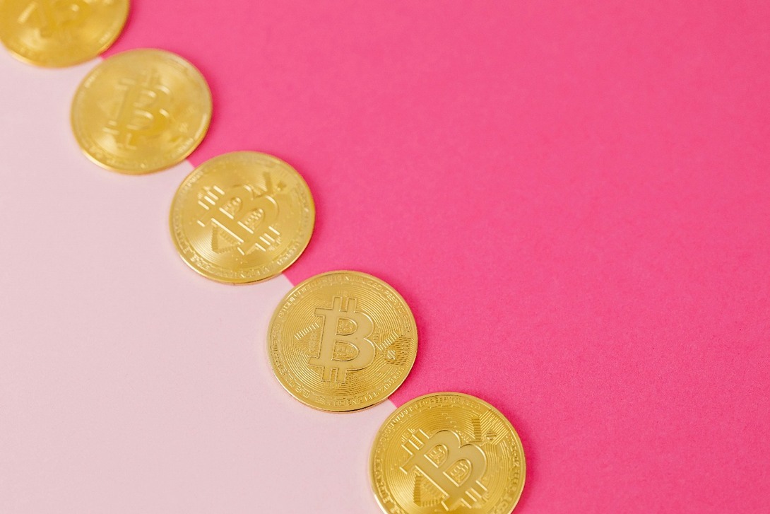 Bitcoins on red surface 